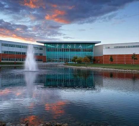 Penta Career Center campus at sunset with its reflecting pond
