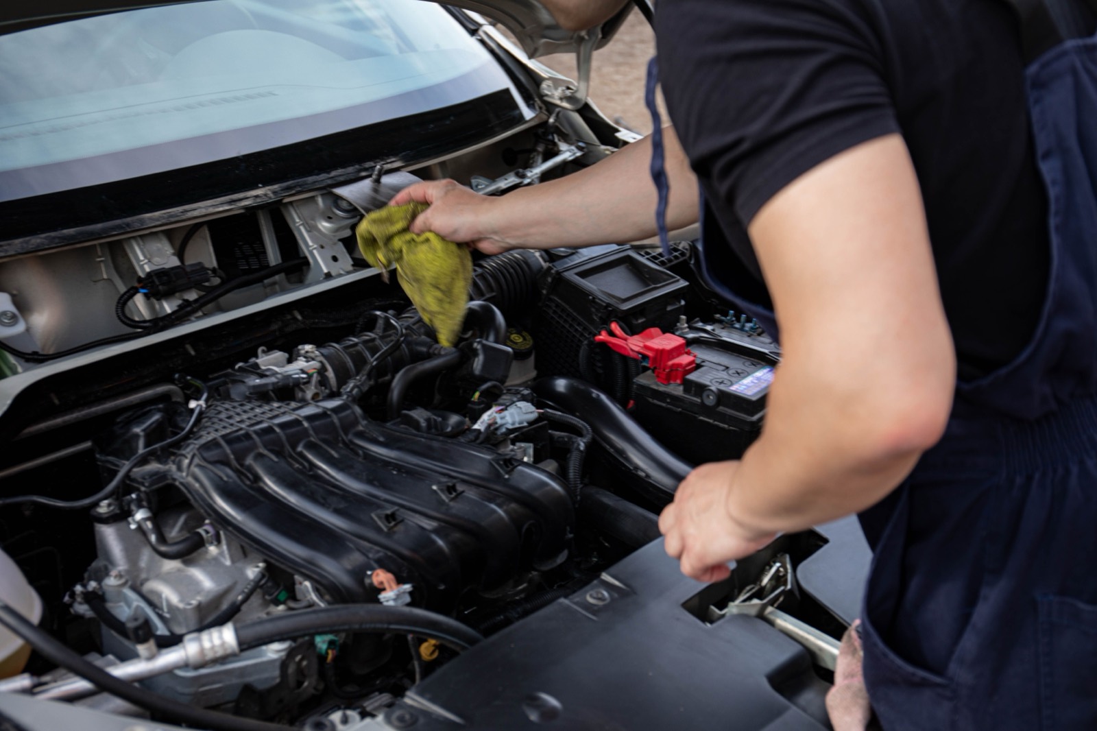Mechanic servicing a vehicle in the shop